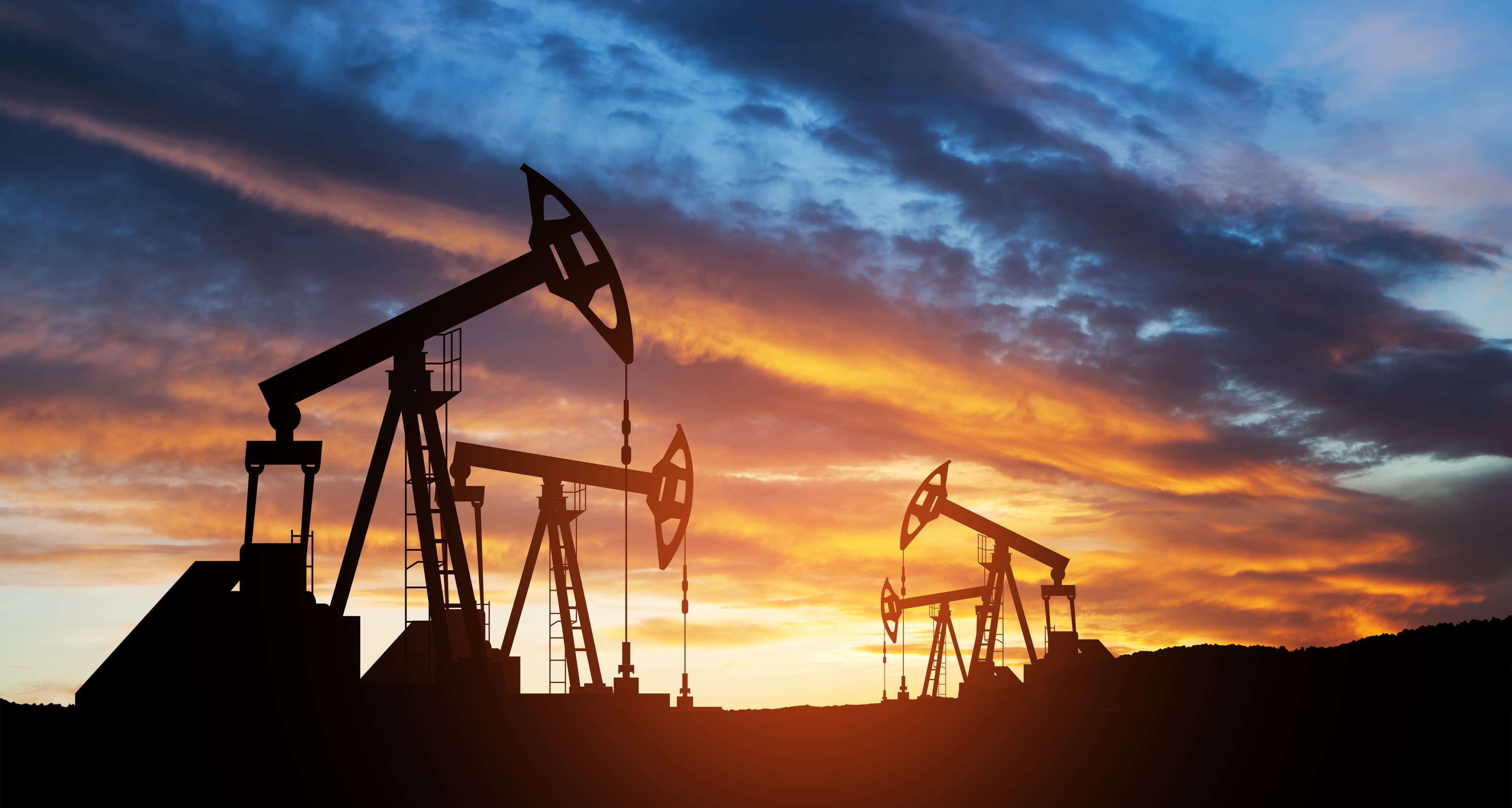 Pumpjacks operating at sunset in the Western Canadian Sedimentary Basin
